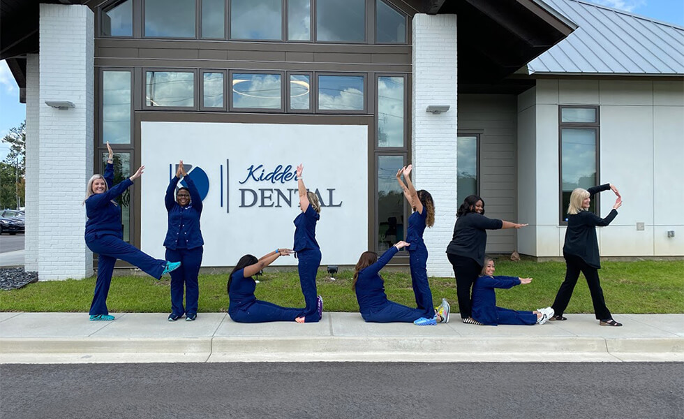 Our dentists in Baton Rouge, LA having fun in front of the Kidder Dental building